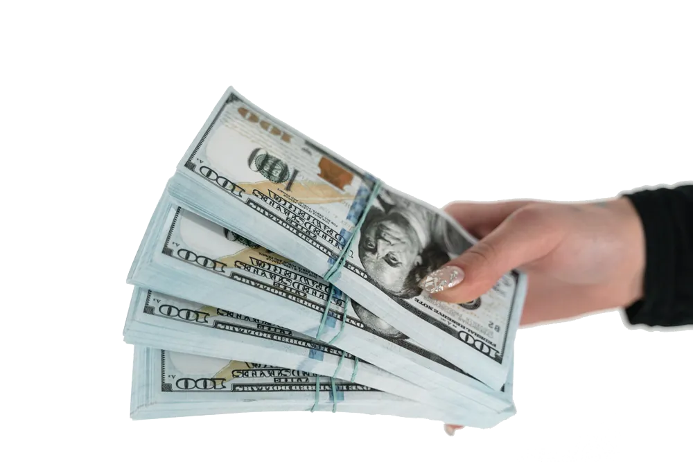 Hand holding bundled $100 US dollar bills against white background.